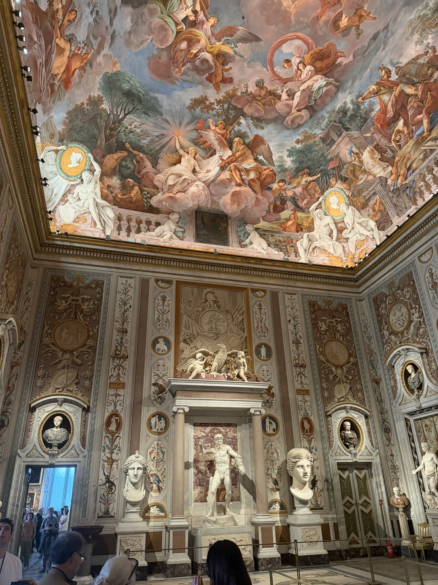 The main hall at Galleria Borghese, fresco ceiling, sculptures, and paintings