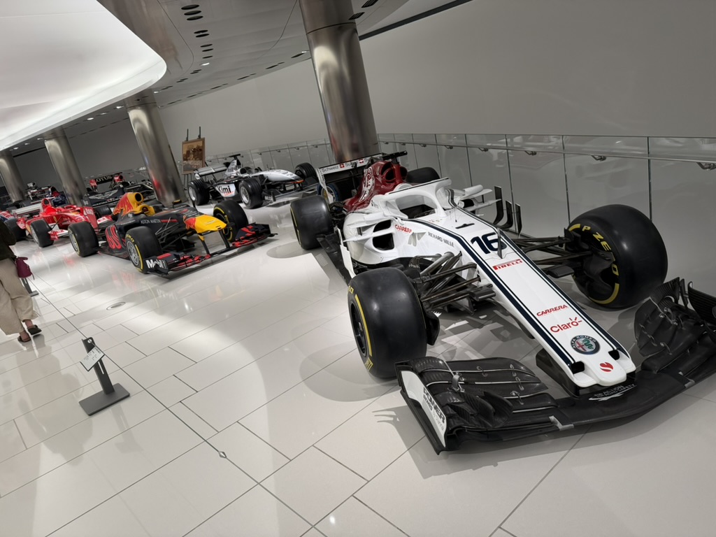 F1 cars at the Prince's Collection, Leclerc's Alfa Romeo/Sauber in the foreground